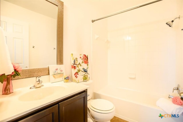 bathroom with shower / bathing tub combination, toilet, and vanity