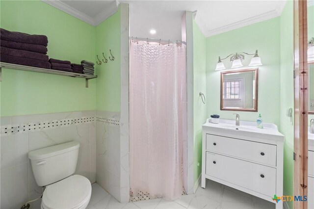 505 N 7th St, Temple, TX 76501 - bathroom with vanity, a shower with curtain, ornamental molding, toilet, and marble finish floor