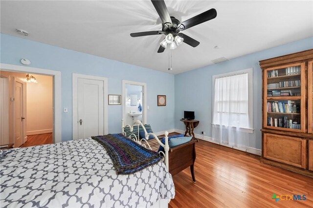 505 N 7th St, Temple, TX 76501 - bedroom with baseboards, ceiling fan, and wood finished floors