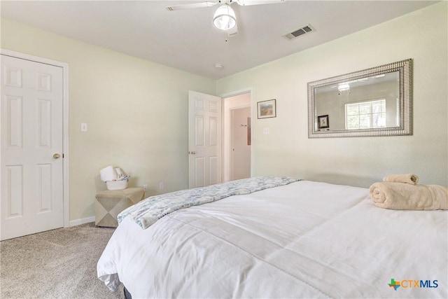 bedroom with a ceiling fan, baseboards, visible vents, and carpet