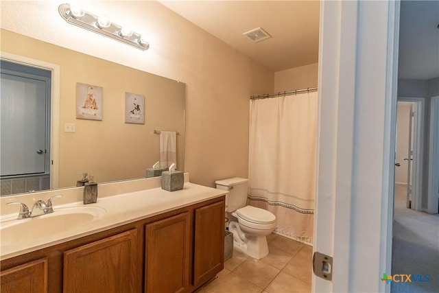 full bathroom with vanity, a shower with shower curtain, visible vents, tile patterned flooring, and toilet