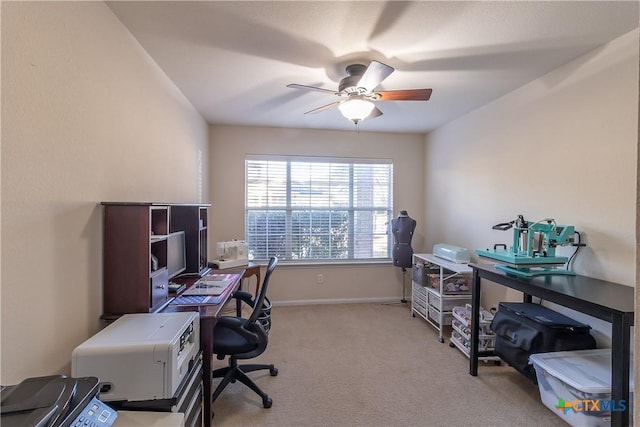 office area with baseboards, carpet, and ceiling fan