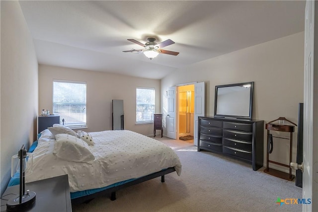 bedroom with light carpet, baseboards, lofted ceiling, and ceiling fan