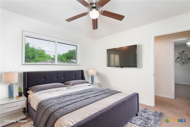 907 S Terrace St, Temple, TX 76501 - bedroom featuring light carpet, baseboards, and a ceiling fan
