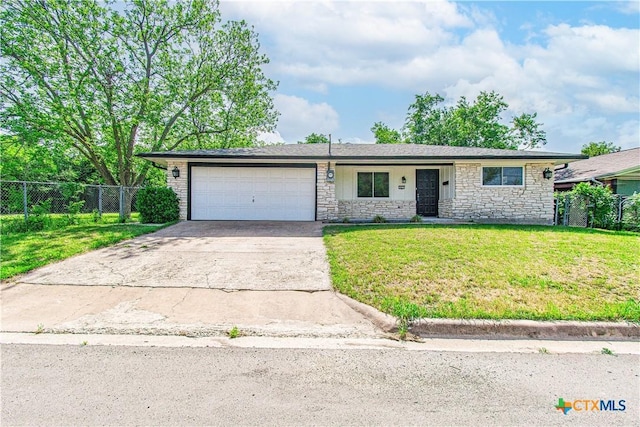 single story home with fence, concrete driveway, stone siding, a front yard, and a garage