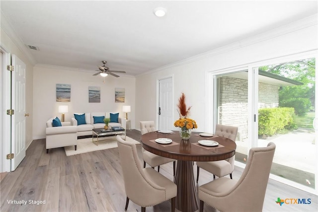 907 S Terrace St, Temple, TX 76501 - dining area with light wood-style flooring, a ceiling fan, and ornamental molding