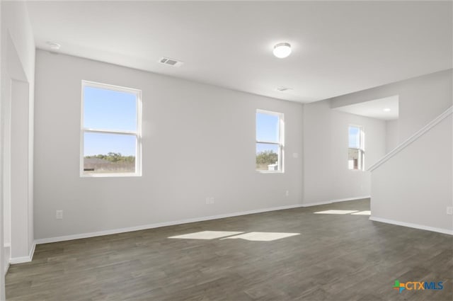 empty room with dark hardwood / wood-style floors