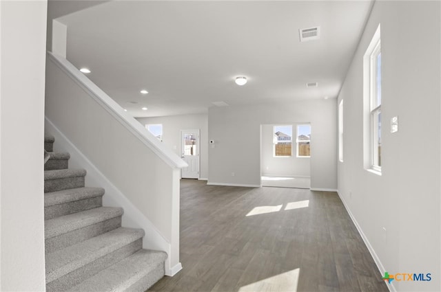 entrance foyer featuring dark hardwood / wood-style flooring