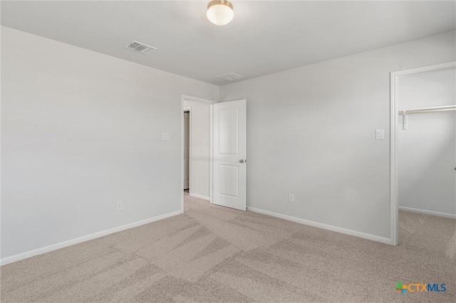 empty room with light colored carpet