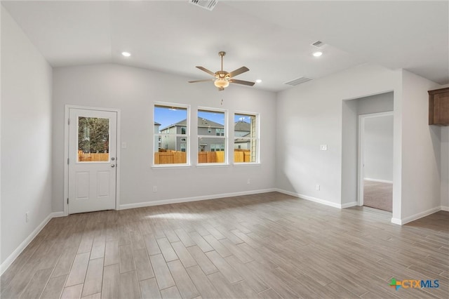 interior space featuring ceiling fan and lofted ceiling