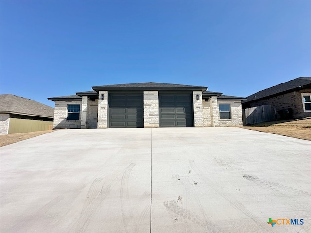 prairie-style home featuring a garage