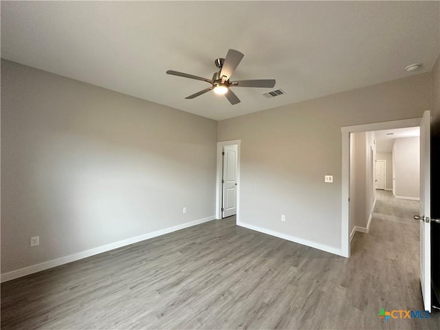 unfurnished bedroom with ceiling fan and light hardwood / wood-style floors