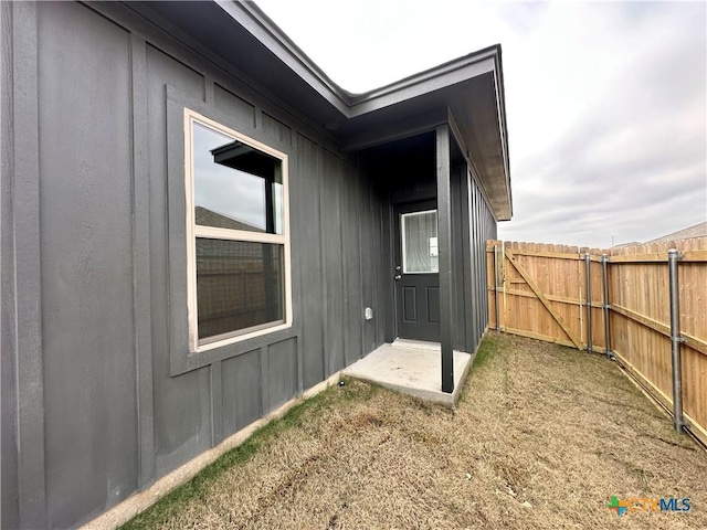 view of side of property featuring a patio area