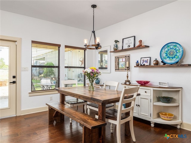 2091 County Road 100, Burnet, TX 78611 - dining area featuring a chandelier, dark wood-style floors, and baseboards