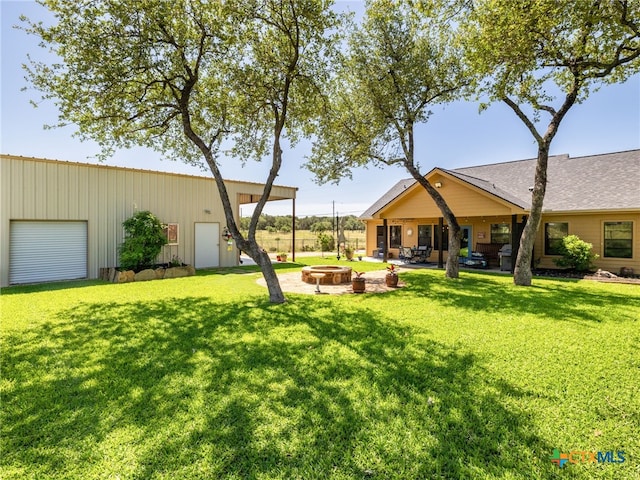 2091 County Road 100, Burnet, TX 78611 - view of grassy yard with a fire pit and a patio