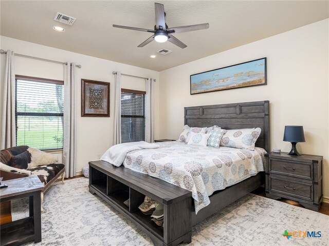 2091 County Road 100, Burnet, TX 78611 - bedroom featuring wood finished floors, recessed lighting, baseboards, and ceiling fan