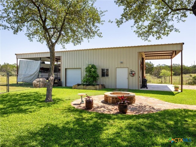 2091 County Road 100, Burnet, TX 78611 - view of pole building featuring a fire pit