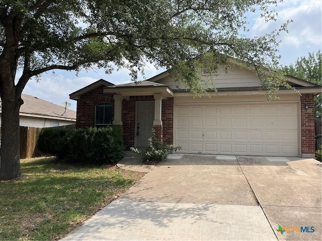 240 Ibis Falls Dr, New Braunfels, TX 78130 - view of front facade featuring brick siding, an attached garage, and concrete driveway