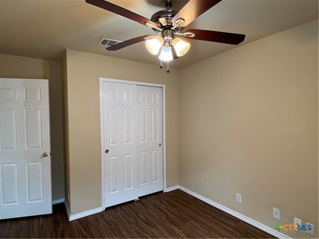 240 Ibis Falls Dr, New Braunfels, TX 78130 - unfurnished bedroom with dark wood finished floors, baseboards, a closet, and ceiling fan