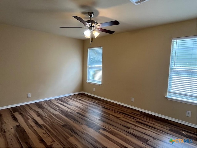 240 Ibis Falls Dr, New Braunfels, TX 78130 - spare room with a ceiling fan, dark wood-style floors, and baseboards