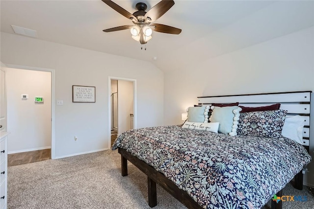 bedroom with carpet flooring, ceiling fan, and vaulted ceiling