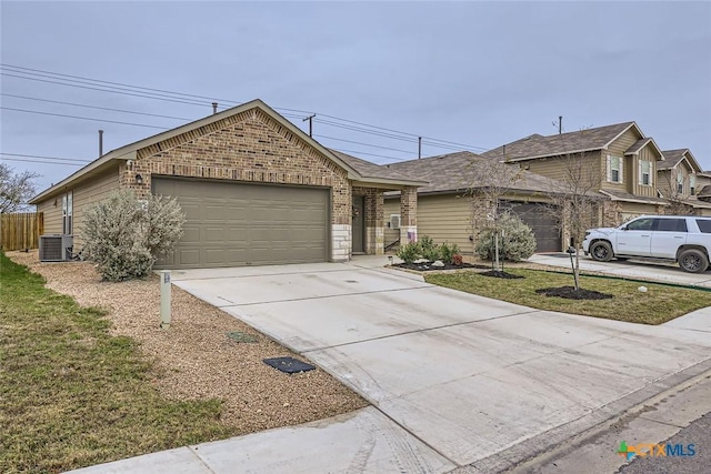 ranch-style house with a garage, central air condition unit, and a front lawn