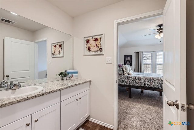 bathroom with ceiling fan and vanity