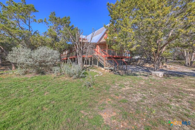 view of yard with a wooden deck