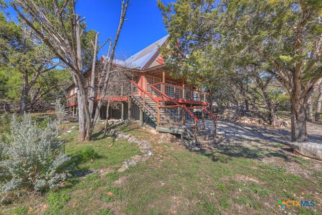 back of house with a wooden deck