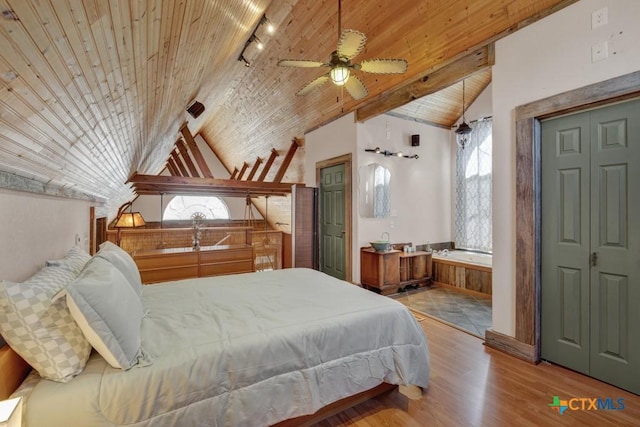 bedroom featuring wood ceiling, lofted ceiling with beams, multiple windows, and light wood-type flooring