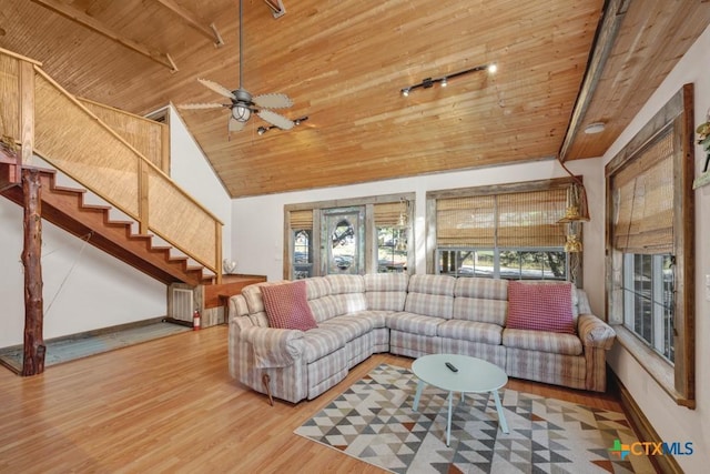 living room with wood-type flooring, high vaulted ceiling, and wood ceiling