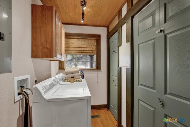 laundry area featuring cabinets, light hardwood / wood-style flooring, washer and dryer, wooden ceiling, and track lighting