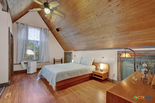 bedroom with light hardwood / wood-style flooring, wooden ceiling, ceiling fan, and vaulted ceiling