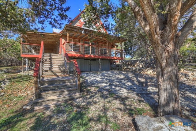 view of front of house featuring a wooden deck