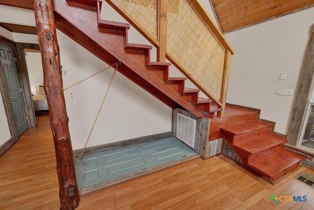 stairway featuring hardwood / wood-style floors