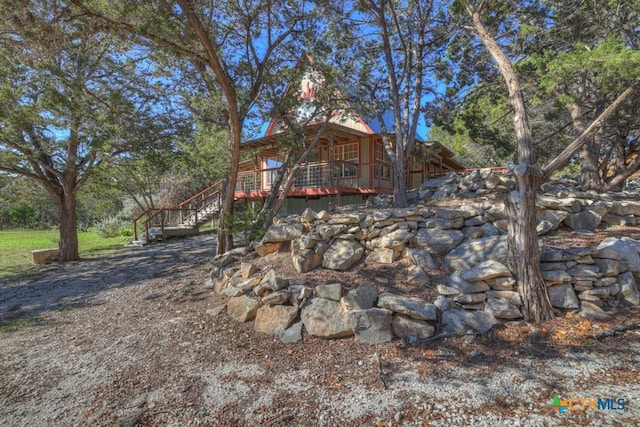 view of yard with a wooden deck