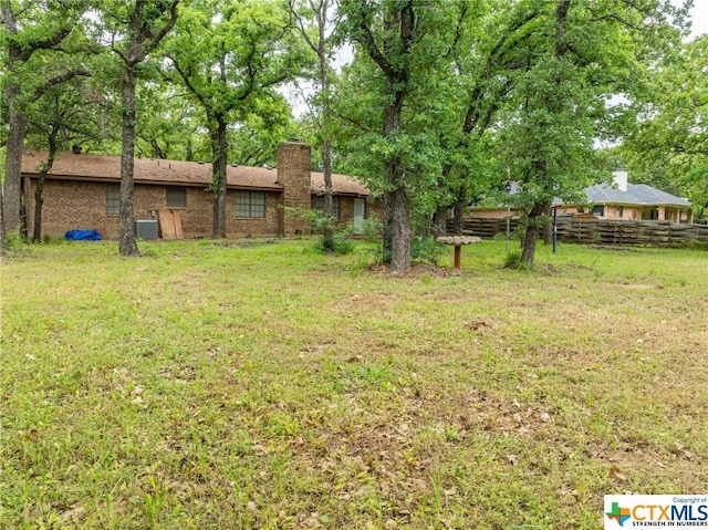 view of yard featuring central AC