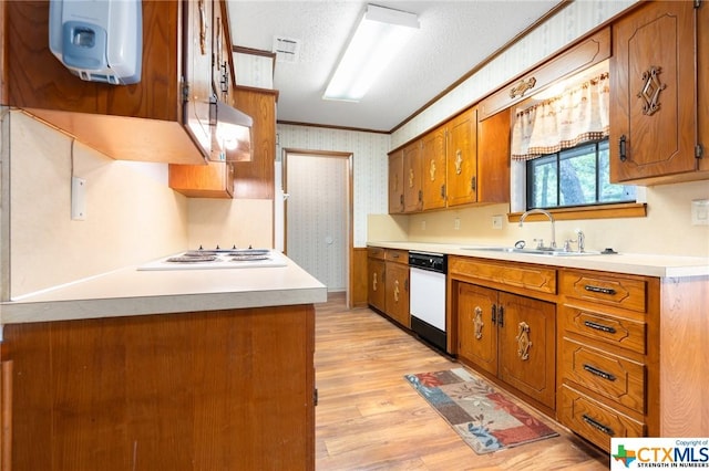 kitchen featuring sink, crown molding, a textured ceiling, white appliances, and light wood-type flooring