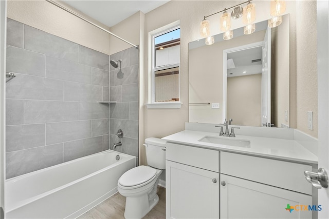 124 Jasmine Ln, Marble Falls, TX 78654 - bathroom featuring toilet, vanity, and bathing tub / shower combination