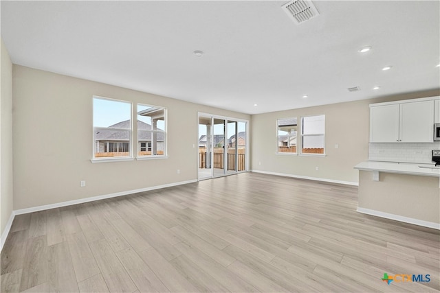 124 Jasmine Ln, Marble Falls, TX 78654 - unfurnished living room with light wood-style floors, baseboards, and recessed lighting