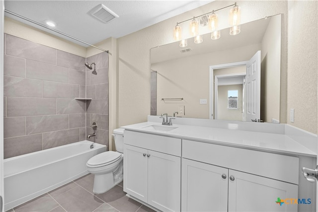 124 Jasmine Ln, Marble Falls, TX 78654 - full bath featuring toilet, vanity, tile patterned flooring, washtub / shower combination, and a textured wall