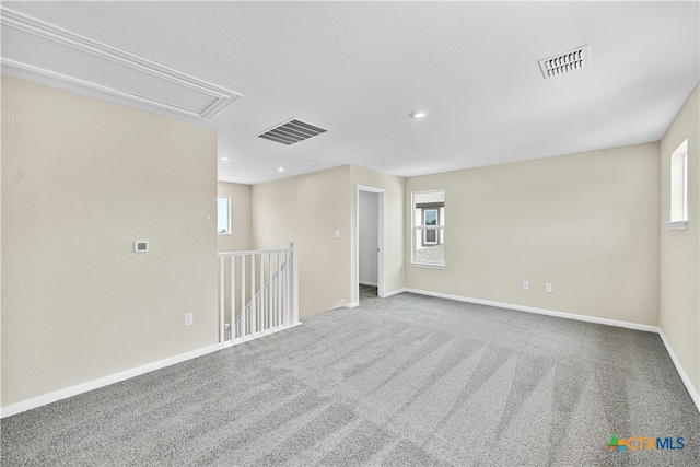 124 Jasmine Ln, Marble Falls, TX 78654 - carpeted spare room featuring attic access, baseboards, and recessed lighting