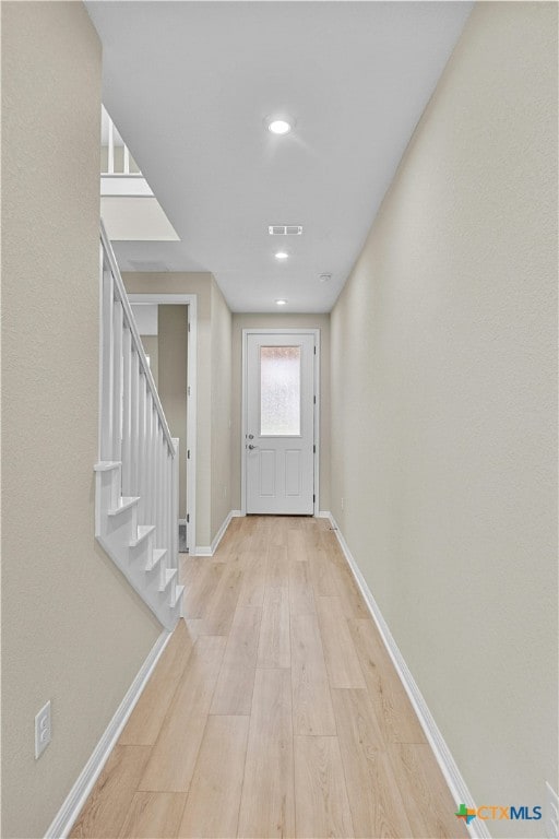 doorway to outside featuring light wood-type flooring