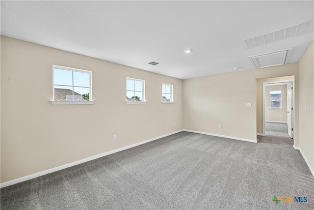 124 Jasmine Ln, Marble Falls, TX 78654 - spare room with attic access, baseboards, and carpet flooring