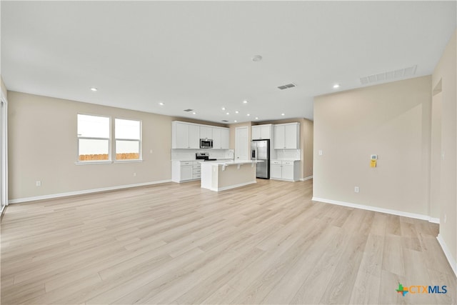 124 Jasmine Ln, Marble Falls, TX 78654 - unfurnished living room with light wood-style floors, recessed lighting, and baseboards