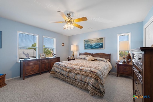 carpeted bedroom featuring ceiling fan