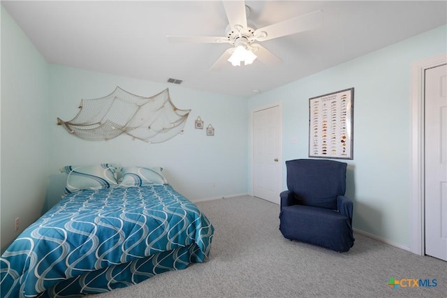 carpeted bedroom with ceiling fan