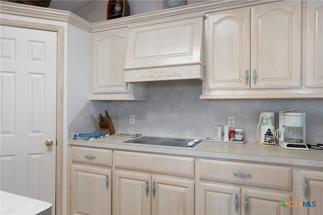 kitchen with electric cooktop, custom range hood, and backsplash