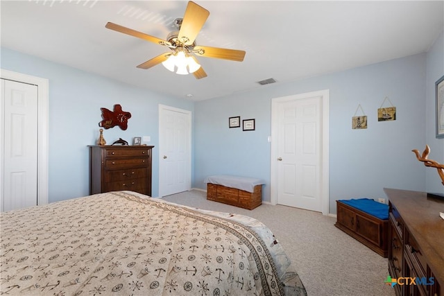 bedroom with light carpet and ceiling fan