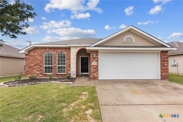 7831 Redbrush, Temple, TX 76502 - ranch-style home featuring brick siding, concrete driveway, a front lawn, and a garage